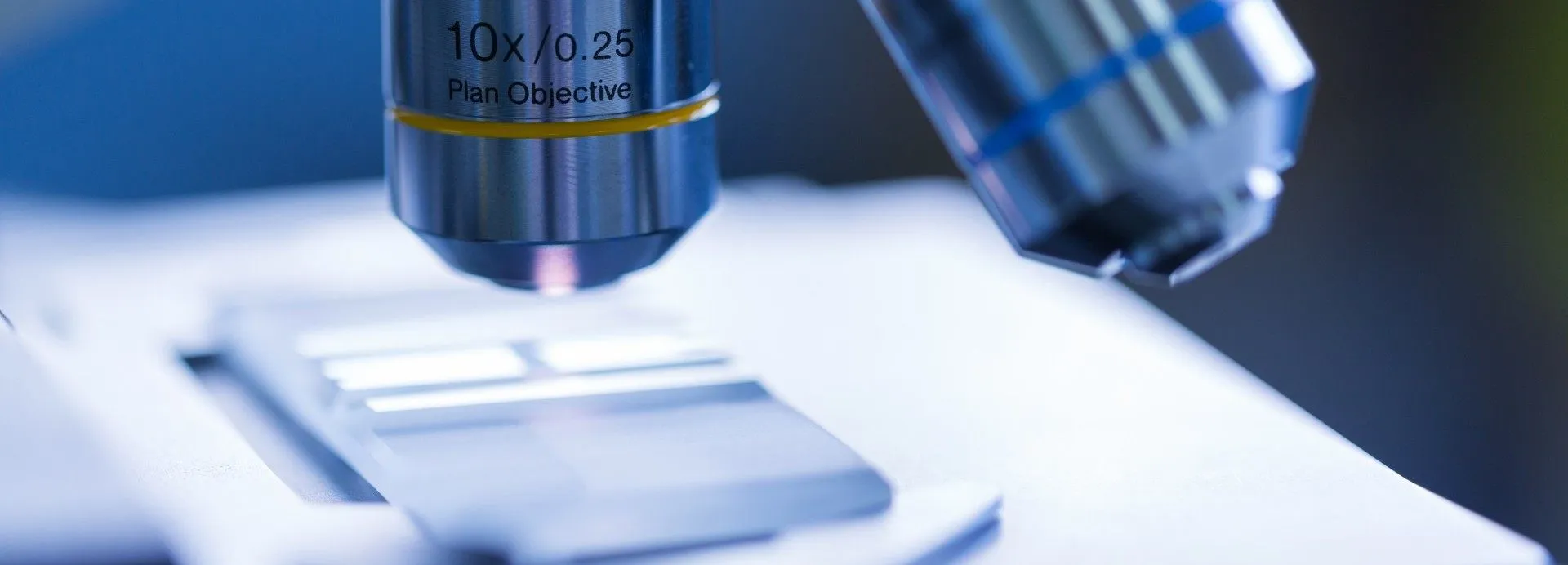 a microscope looking closely at a slide