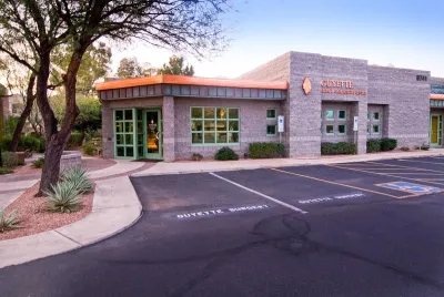 The outside of the office building with ample parking