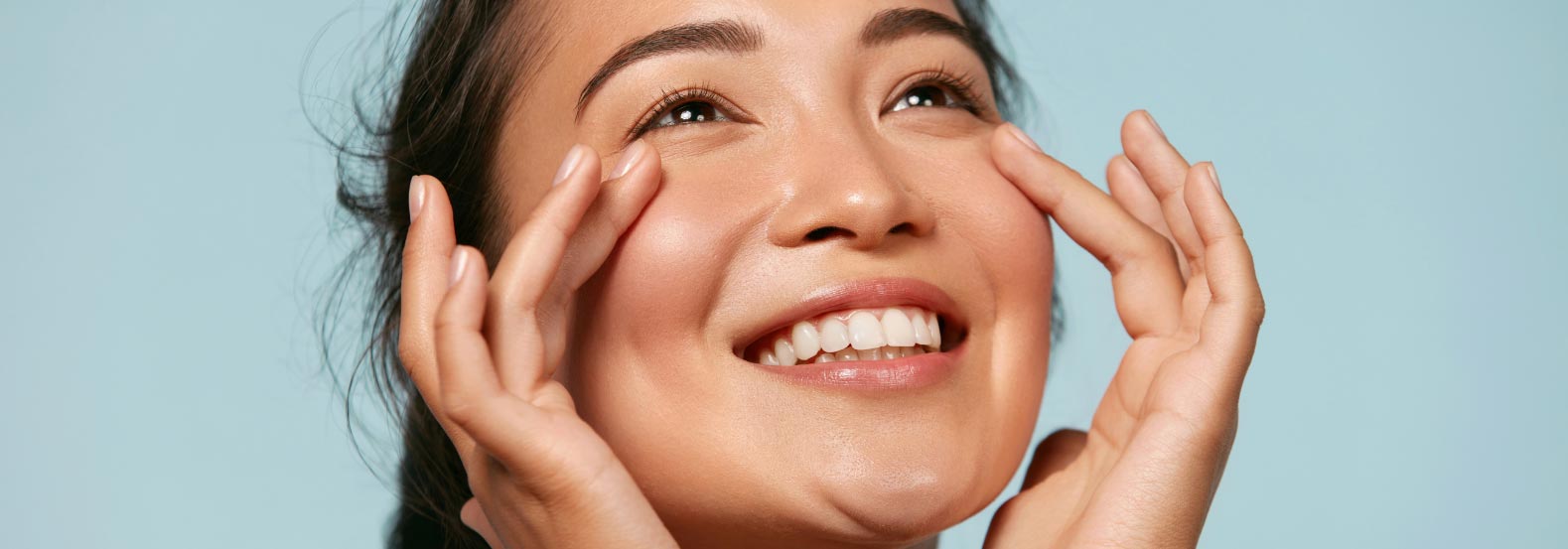 A woman smiling & showcasing the result of Botox treatment in Scottsdale & Avondale, AZ